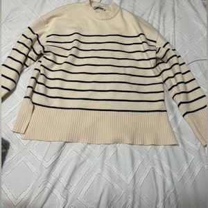 Zara’s knit sweater.